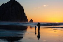 Child Silhouettes. Sunset On Morro Bay Beach With Father And Baby Enjoying The View
