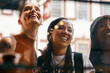 © peopleimages.com - Cafe, window and group of women with smile, bonding and social lunch in city together. Sidewalk, fun and happy girl friends checking menu choice at restaurant for urban brunch on summer weekend.