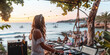 © WD Stock Photos - Young girl dj mixing outdoor during summer beach party at sunset time