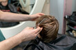 © Anfisa&friends/Stocksy - Barber with giving  boy  haircut