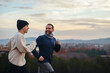 © BONNINSTUDIO/Stocksy - Happy family running in countryside