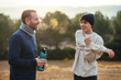 © BONNINSTUDIO/Stocksy - Father and son with bottle of water resting after training
