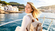 © Karen Images - Woman tourist travels by boat on the sea.