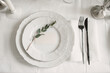 © Amor Burakova/Stocksy - White Wedding Table Setting