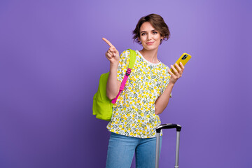 Photo attractive charming brown hair girl stylish clothes recommend hotel reservation empty space isolated on purple color background