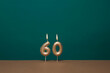© Juan Moyano/Stocksy - lit candles forming the number 60