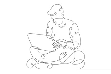 Wall Mural - Young man sits with laptop. Communication and work on the Internet. Boy communicates using a computer.One continuous line .One continuous drawing line logo isolated minimal illustration.