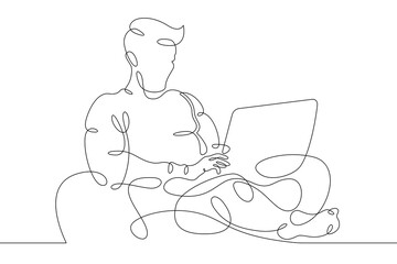 Wall Mural - Young man sits with laptop. Communication and work on the Internet. Boy communicates using a computer.One continuous line .One continuous drawing line logo isolated minimal illustration.