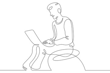 Wall Mural - Young man sits with laptop. Communication and work on the Internet. Boy communicates using a computer.One continuous line .One continuous drawing line logo isolated minimal illustration.