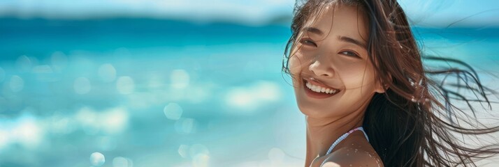 Wall Mural - Portrait of a beautiful smiling woman at the beach, enjoying a sunny day by the ocean. Perfect for summer, travel, and lifestyle themes.