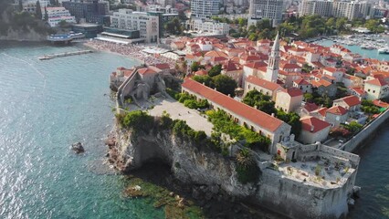 Wall Mural - Aerial view of Budva, old and modern city on Adriatic Sea coast. Center of Montenegrin tourism and popular sea resort.