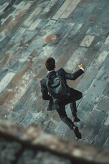 Poster - A man in a suit and tie walking up a flight of stairs. Suitable for business and success concepts