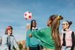 © VICTOR TORRES/Stocksy - Youthful friends playing soccer in the park