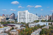 Aerial view captures urban cityscape featuring modern skyscrapers and residential buildings