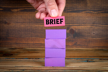 Wall Mural - Brief Concept. Purple wooden blocks in a pile on a wooden texture background