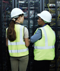 Canvas Print - Computer core, women and data programmer as engineer in communication center in teamwork or collaboration. Female people, tech and hardware for security in server core in system update or maintenance