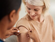 © peopleimages.com - Happy, mature woman and plaster for vaccine or flu injection from nurse in clinic for health and wellness. Senior, female person and smile with bandage for medicine, healthcare and illness protection