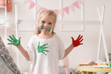 Wall Mural - Cute little girl in paint at home