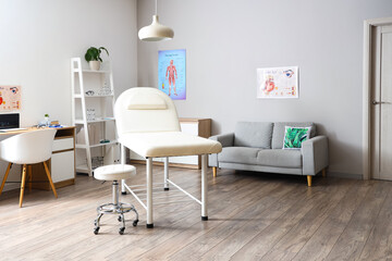 Canvas Print - Interior of medical office with couch, sofa and doctor's workplace