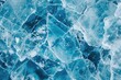 © At My Hat - The image is of a blue surface with many pieces of ice. Scene is cold and desolate, as the ice pieces seem to be broken and scattered