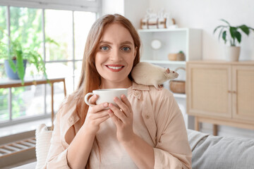 Sticker - Beautiful redhead woman with cute white rat drinking tea at home, closeup