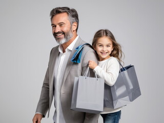 Father and daughter happily carrying shopping bags