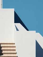 minimalist architecture with geometric shapes, sharp shadows, and blue sky, highlighting modern desi