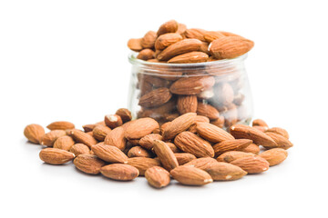 Sticker - Peeled almond nuts in jar isolated on white background.