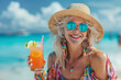 © erika8213 - Old woman with cocktail on the beach. Summer vacation concept.