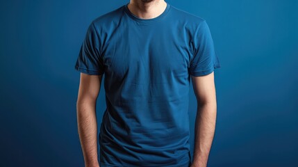 Front view, Cropped image, Young man in a blue t-shirt standing over color background, Advertising space, mock up, Branded t-shirt mockup on a person, Mockup for design, Man in blue t-shirt in front
