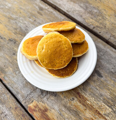 Sticker - Pancakes in a plate on a wooden table