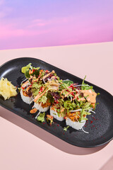 Wall Mural - Salmon roll sushi with a mix of salad on top, elegantly presented on a black plate with surreal floral spring and summer theme