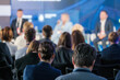 © Anton Gvozdikov - Focused audience listening to speakers at a business conference panel discussion. Event promotes networking and professional development opportunities.