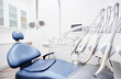 © Loginova - Dental equipment in dentist office in new modern stomatological clinic room. Background of dental chair and accessories used by dentists in blue and white.