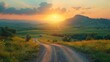 © ZethX - Serene countryside dirt road leading to a mountain at sunset. Beautiful landscape with green rolling hills and vibrant colors.