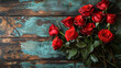 © Waleed - Beautiful fresh red rose sitting on a wooden desk