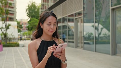 Poster - Woman use of mobile phone at street