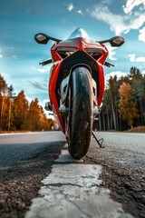 Aufkleber - A red motorcycle parked on the side of a road. Suitable for transportation concepts