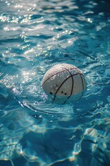 Poster - A serene image of a white ball floating in calm water. Suitable for various design projects