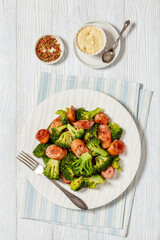 Wall Mural - fried juicy sausage and crispy broccoli on plate