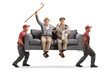 © Ljupco Smokovski - Happy elderly men sitting on a sofa carried by movers