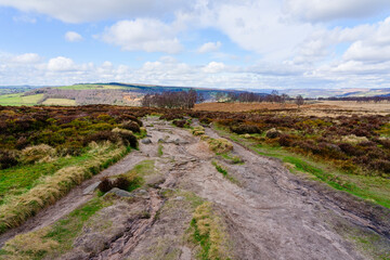 Poster - Rock strewn path across rugged Derbyshire moorland