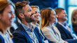 © mattegg - Happy entrepreneurs communicating while attending business seminar in conference hall