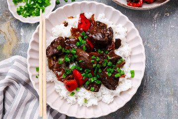 Wall Mural - Chinese chicken liver with peppers and onions in the bowl