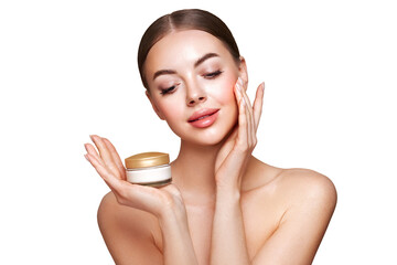 Wall Mural - beauty woman applying cream on her face. young woman with clean fresh skin. model with a jar of face