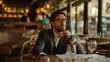 © Ali - portrait of a businessman sitting in a restaurant waiting for meeting with an investor
