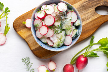 dietary northern summer salad with cucumbers, radishes and natural yoghurt or sour cream, healthy su