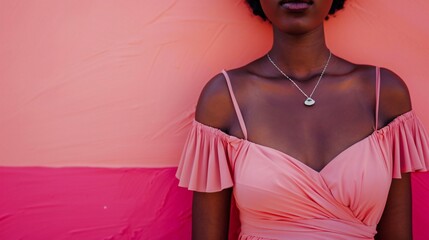 Wall Mural - Close up view of a beautiful african woman wearing a pink dress, with accessories, on a modern pink background