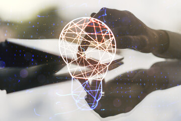 Poster - Double exposure of creative light bulb hologram with finger clicks on a digital tablet on background, research and development concept