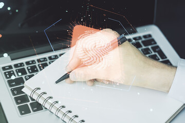 Aufkleber - Double exposure of abstract creative fingerprint hologram with hand writing in notepad on background with laptop, protection of personal information concept